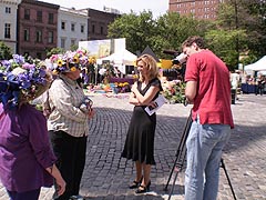 [photo, Local television crew interviews Baltimore Flowermart attendees, Mount Vernon Place, Baltimore, Maryland]