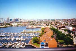 [photo, Skyline, townhouses, and marinas on Patapsco River (view from Canton), Baltimore, Maryland]